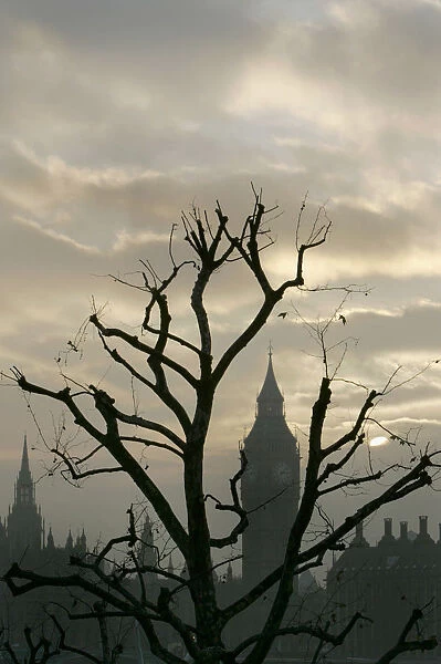 The sun sets behind Houses of Parliament in central London