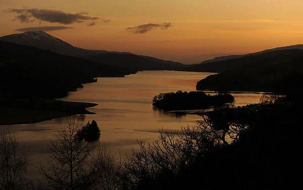 The sun sets over Loch Tummel seen from Queens View in Perthshire, Scotland