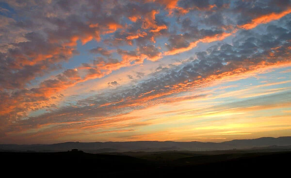 The sun sets over the Val d Orcia close to the Tuscan town of Montalcino