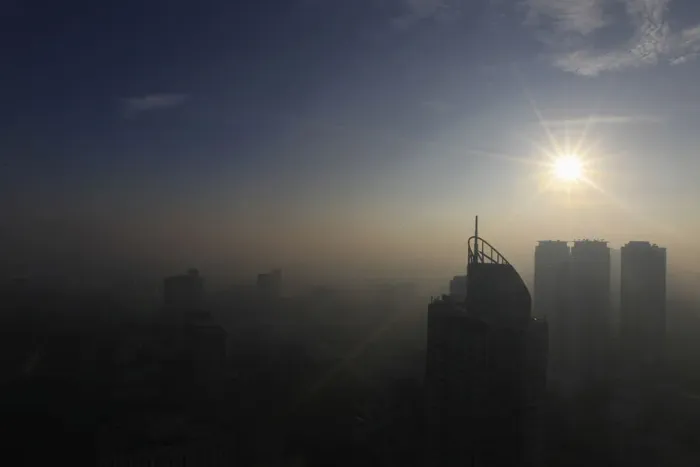 Framed Print : The sun shines on the first day of 2014 as smog from the New Year revelry covered high Framed Print : The sun shines on the first day of 2014 as smog from the New Year revelry covered high
