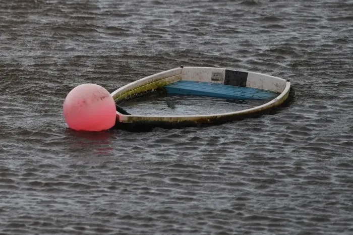Framed Print : A sunken boat is seen half submerged after Storm Eleanor in Galway Bay