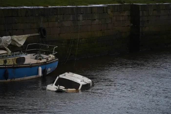 Framed Print : A sunken boat is seen half submerged after Storm Eleanor in Galway Bay Framed Print : A sunken boat is seen half submerged after Storm Eleanor in Galway Bay