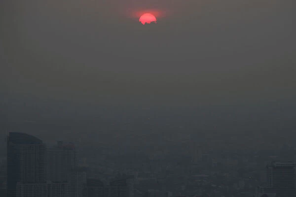 The sunset is seen during a poor air quality day in Bangkok