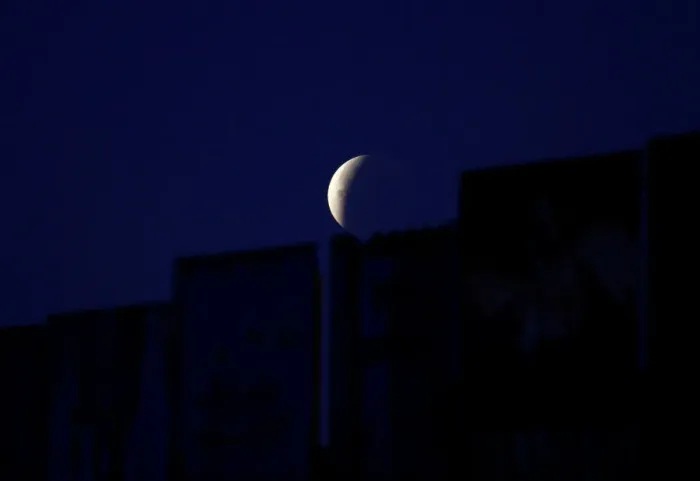 Framed Print : A Super Blue Blood Moon rises during a lunar eclipse in this picture taken from Framed Print : A Super Blue Blood Moon rises during a lunar eclipse in this picture taken from