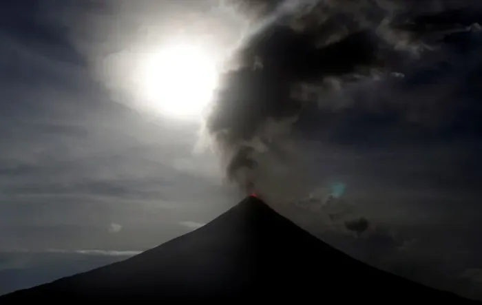 Framed Print : The super blue moon rises above the spewing Mayon Volcano during a mild eruption before a Framed Print : The super blue moon rises above the spewing Mayon Volcano during a mild eruption before a