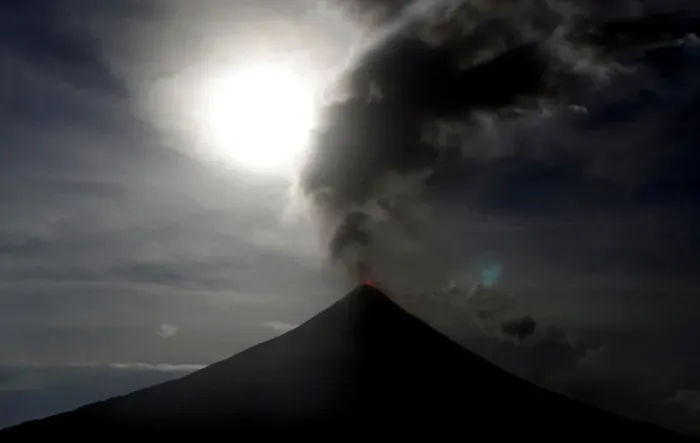 Framed Print : The super blue moon rises above the spewing Mayon Volcano during a mild eruption before a Framed Print : The super blue moon rises above the spewing Mayon Volcano during a mild eruption before a