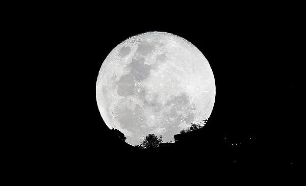 A super moon is pictured next to the Monserrate church in Bogota