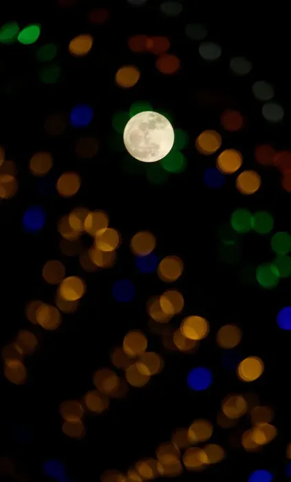 Framed Print : The supermoon full moon is seen through Christmas lights in Valletta
