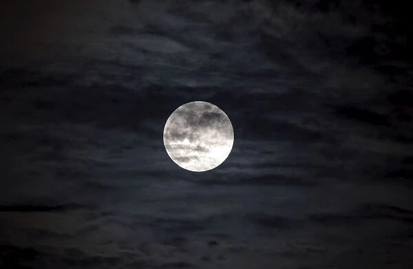 A supermoon, the last of this years supermoons, is pictured in the sky in Managua