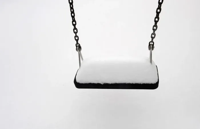 Framed Print : A swing is covered in snow after a snowstorm in the town of Pajares