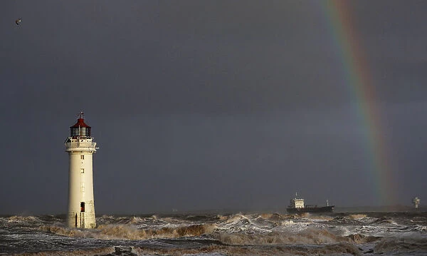 A tanker battles through heavy seas as it passes Perch Rock lighthouse on the River