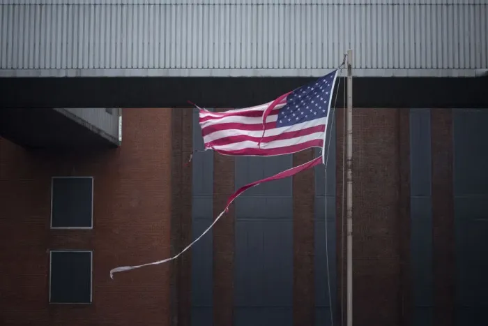 Framed Print : A tattered U. S. flag flies at the Con Edison Substation in Downtown Manhattan after Framed Print : A tattered U. S. flag flies at the Con Edison Substation in Downtown Manhattan after