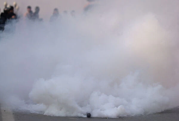 A tear gas shell fired by Indian police explodes during a protest march in Srinagar