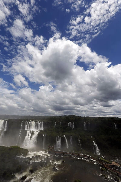 Tourists look at the Iguazu Falls from an observation platform at the Iguazu National