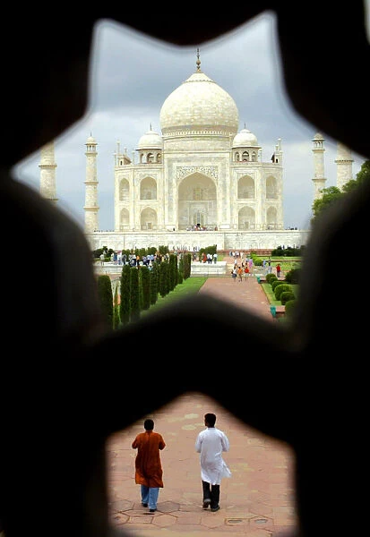 Tourists visit the Taj Mahal in the tourist city of Agra