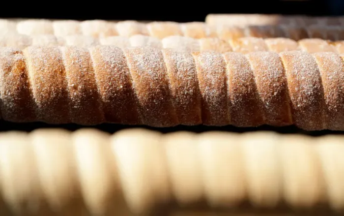 Framed Print : Traditional Trdelnik sweet pastries are prepared at a market in Prague