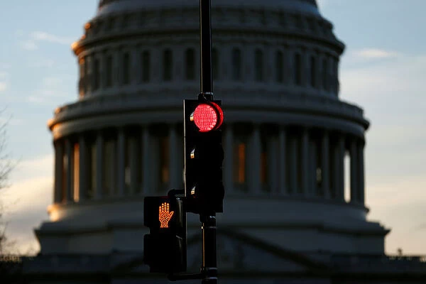 A traffic light shines red after President Donald Trump and the U. S