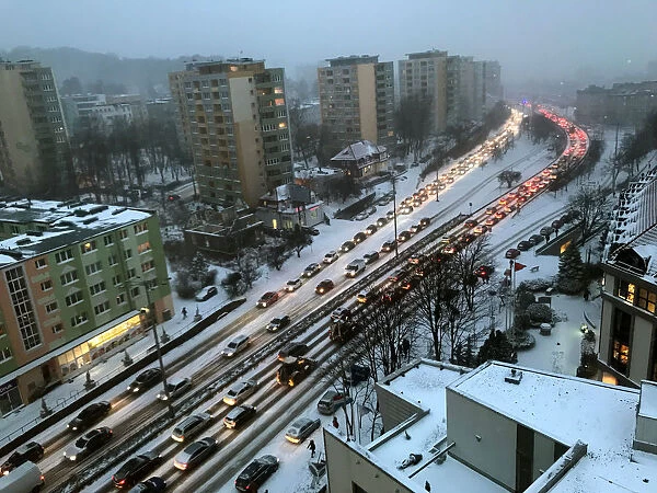 Traffic is stalled during a snowfall in Gdynia
