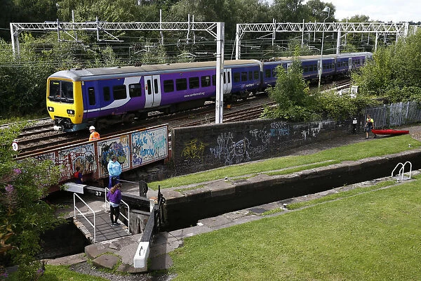 A train passes a canal in Stoke-on-Trent