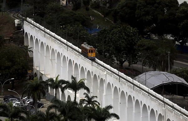 Tram is seen on a line over the Lapa Arches, an old aqueduct from the colonial era