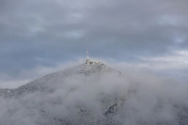 Transmission antenna is seen covered in snow at the Cerro de la Silla mountain after a