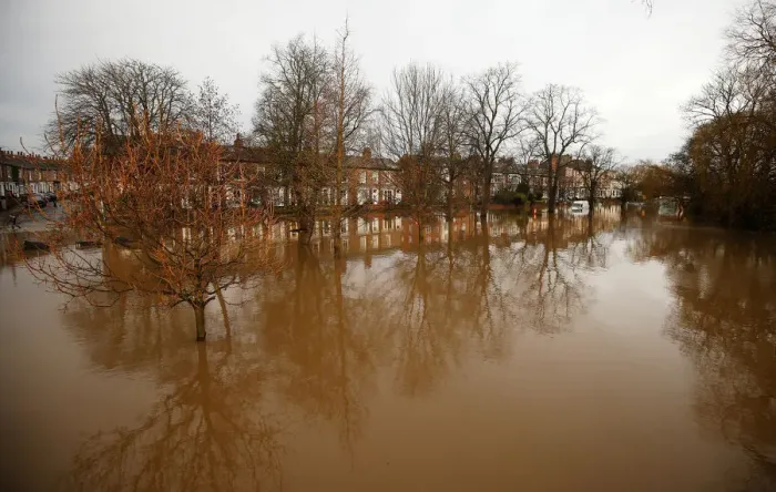 Framed Print : Trees are reflected in flood water on Huntingdon Road in York after the river Ouse burst Framed Print : Trees are reflected in flood water on Huntingdon Road in York after the river Ouse burst