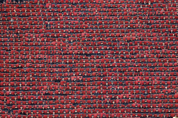 Troops hold coloured cards during a military parade celebrating Independence Day at