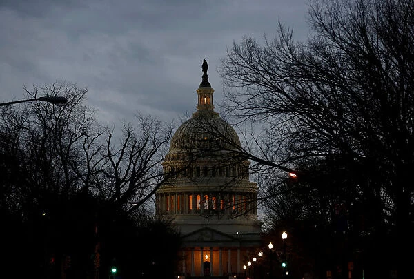 The U. S. Capitol is lit during the second day of a shutdown of the federal government in