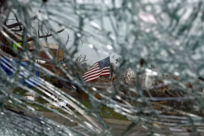 Framed Print : A U. S. flag is seen through a shattered car windshield in Joplin, Missouri Framed Print : A U. S. flag is seen through a shattered car windshield in Joplin, Missouri