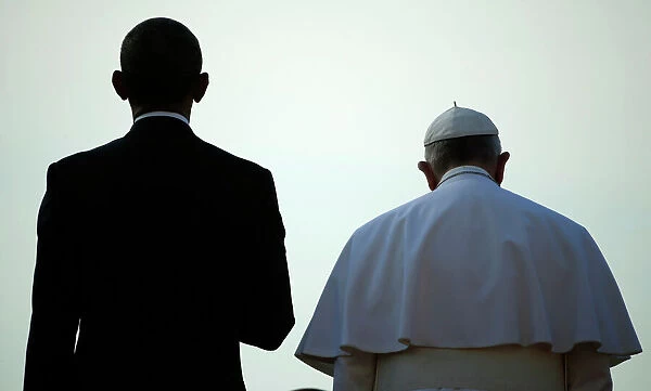 U. S. President Obama stands with Pope Francis during an arrival ceremony at the White
