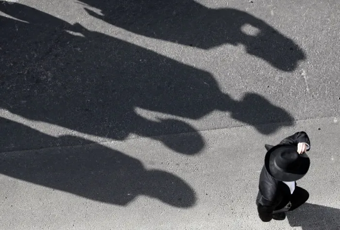 Framed Print : An ultra-Orthodox Jew attends the funeral of Rabbi Menahem Porush in Jerusalem