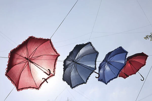 Umbrellas decorate a main shopping district in Beiruts suburbs as part of a shopping