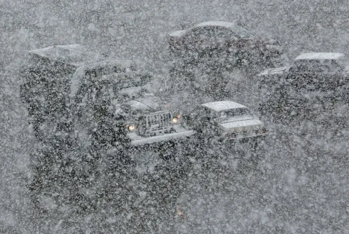 Framed Print : Vehicles drive along a road during a heavy snowfall in the Siberian town of Divnogorsk Framed Print : Vehicles drive along a road during a heavy snowfall in the Siberian town of Divnogorsk
