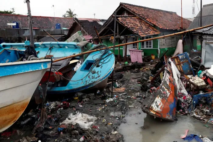 Framed Print : Vessels are washed up next to houses after a tsunami hit in Anyer Framed Print : Vessels are washed up next to houses after a tsunami hit in Anyer