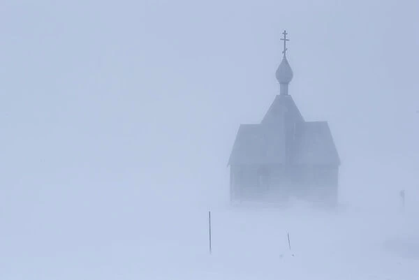 A view shows a church during a heavy snowfall in a settlement on the Pechora Sea island