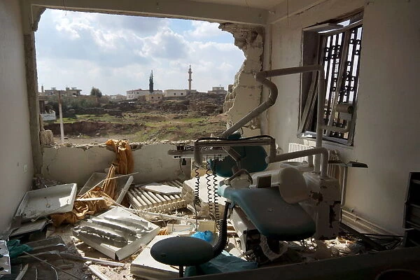 A view shows a damaged clinic after airstrikes by pro-Syrian government forces in the