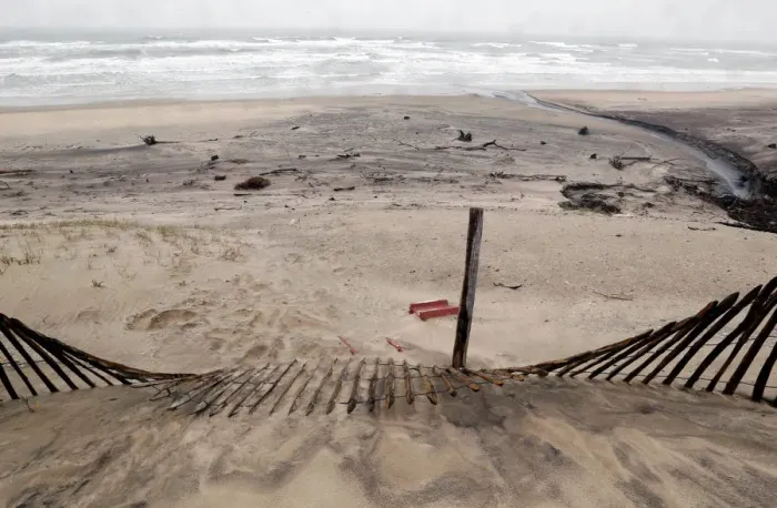 Framed Print : A view shows a damaged sand dune from erosion of the Atlantic Ocean coastline in Soulac