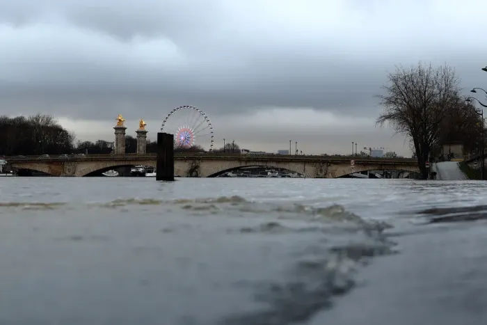 Framed Print : A view shows the Pont Alexandre III bridge and flooded banks of the Seine River after