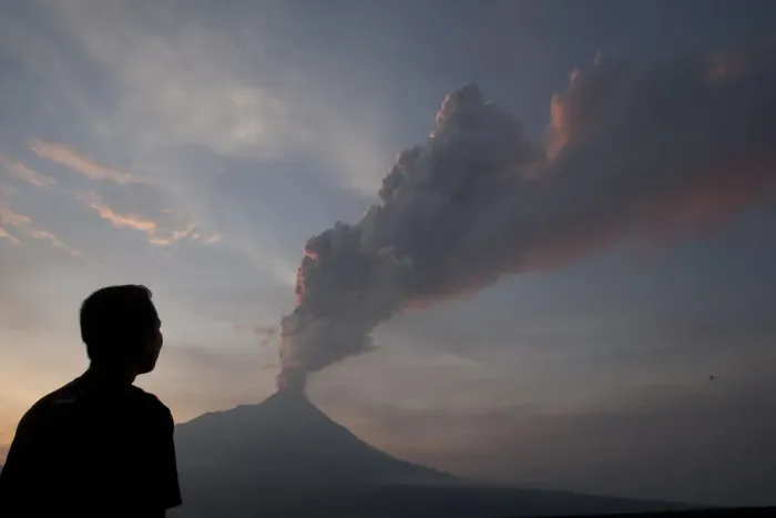 Framed Print : A villager looks at Mount Merapi spewing smoke and ash, at Ketep in Magelang Framed Print : A villager looks at Mount Merapi spewing smoke and ash, at Ketep in Magelang