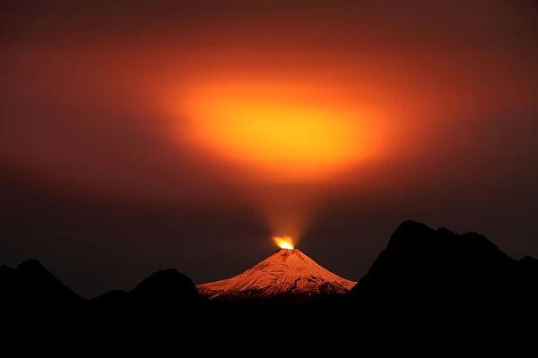 The Villarrica Volcano is seen at night in Pucon town