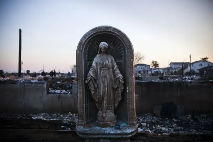 Framed Print : A Virgin Mary statue is seen amongst the rubble of a destroyed row of houses after Framed Print : A Virgin Mary statue is seen amongst the rubble of a destroyed row of houses after