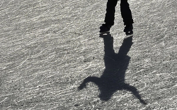 A visitor skates on the ice rink at Tower of London