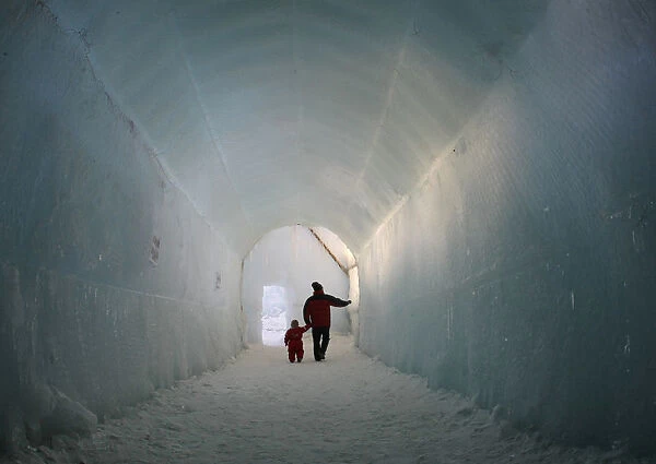 Visitors walk past huge ice sculptures at Chitose-Lake Shikotsu Ice Festival in Chitose