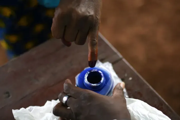 Framed Print : A voters finger is marked with ink at a polling station during a presidential run-off in Framed Print : A voters finger is marked with ink at a polling station during a presidential run-off in