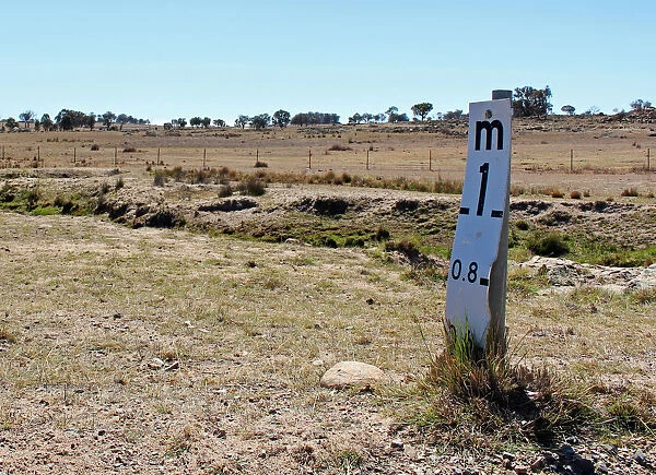 A water level indicator stands next to a near-empty creek near the town of Uralla