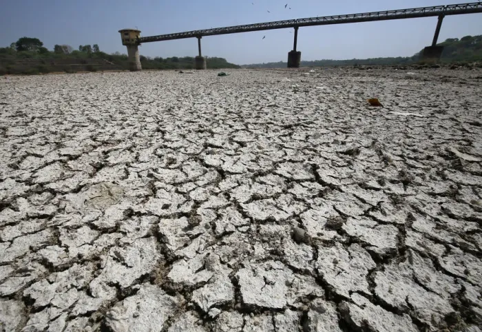 Framed Print : A water pump shed is seen in the dried-up portion of the Sabarmati river on a hot day Framed Print : A water pump shed is seen in the dried-up portion of the Sabarmati river on a hot day