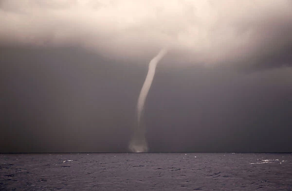 A waterspout is seen from the German NGO Sea-Eye migrant rescue ship Alan Kurdi as it