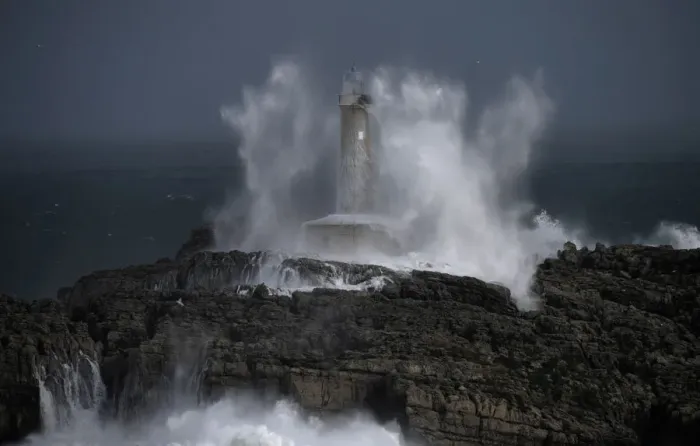 Framed Print : Waves crash on the lighthouse of La Isla del Mouro in the port town of Santander in Framed Print : Waves crash on the lighthouse of La Isla del Mouro in the port town of Santander in