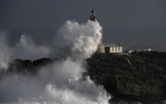 Framed Print : Waves crash on the lighthouse of La Isla del Mouro in the port town of Santander in Framed Print : Waves crash on the lighthouse of La Isla del Mouro in the port town of Santander in