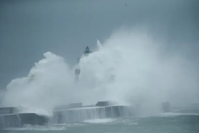Framed Print : Waves crash against a lighthouse during a windy day in Boulogne-sur-Mer Framed Print : Waves crash against a lighthouse during a windy day in Boulogne-sur-Mer